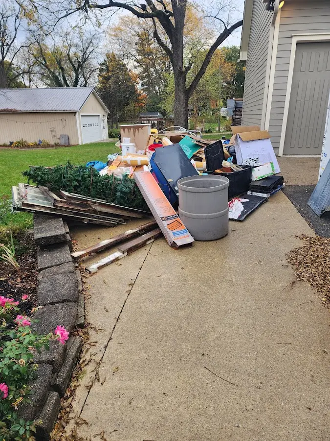 Dumpster being loaded with debris for Roofing Dumpster Rental in San Pablo
